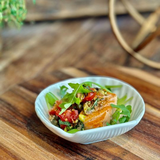 Semi-cooked salmon with fennel seeds, Sicilian salsa with capers and pistachios |