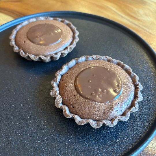 Chocolate soufflé tartlet with pistachio ice cream |