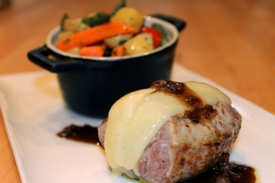 Pork tenderloin with gruyere cheese, warm shallot dressing, market vegetables