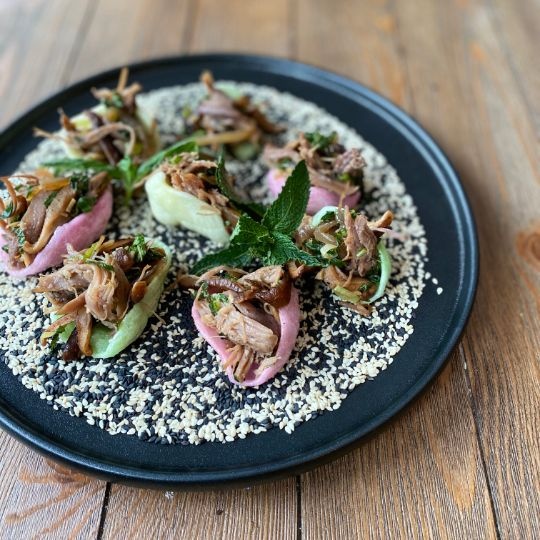 Shredded duck confit, shrimp chips, shiitake and green onions with honey, fresh chives