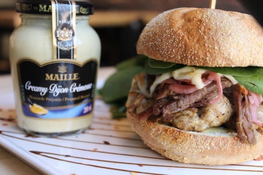 Chicken burger and duck confit, creamy dijon mustard, Gruyere cheese and baby spinach salad |