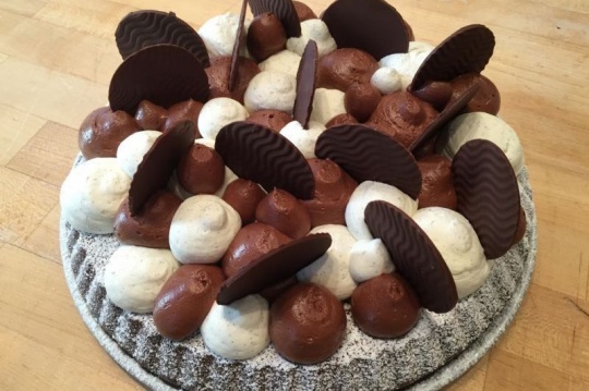 Moist chocolate cake, chocolate mousse drops and chocolate tiles |